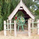 A pump and well house at East Ilsley - a 1930's flywheel pump which is still in working order.