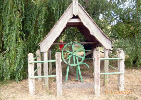A pump and well house at East Ilsley - a 1930's flywheel pump which is still in working order.